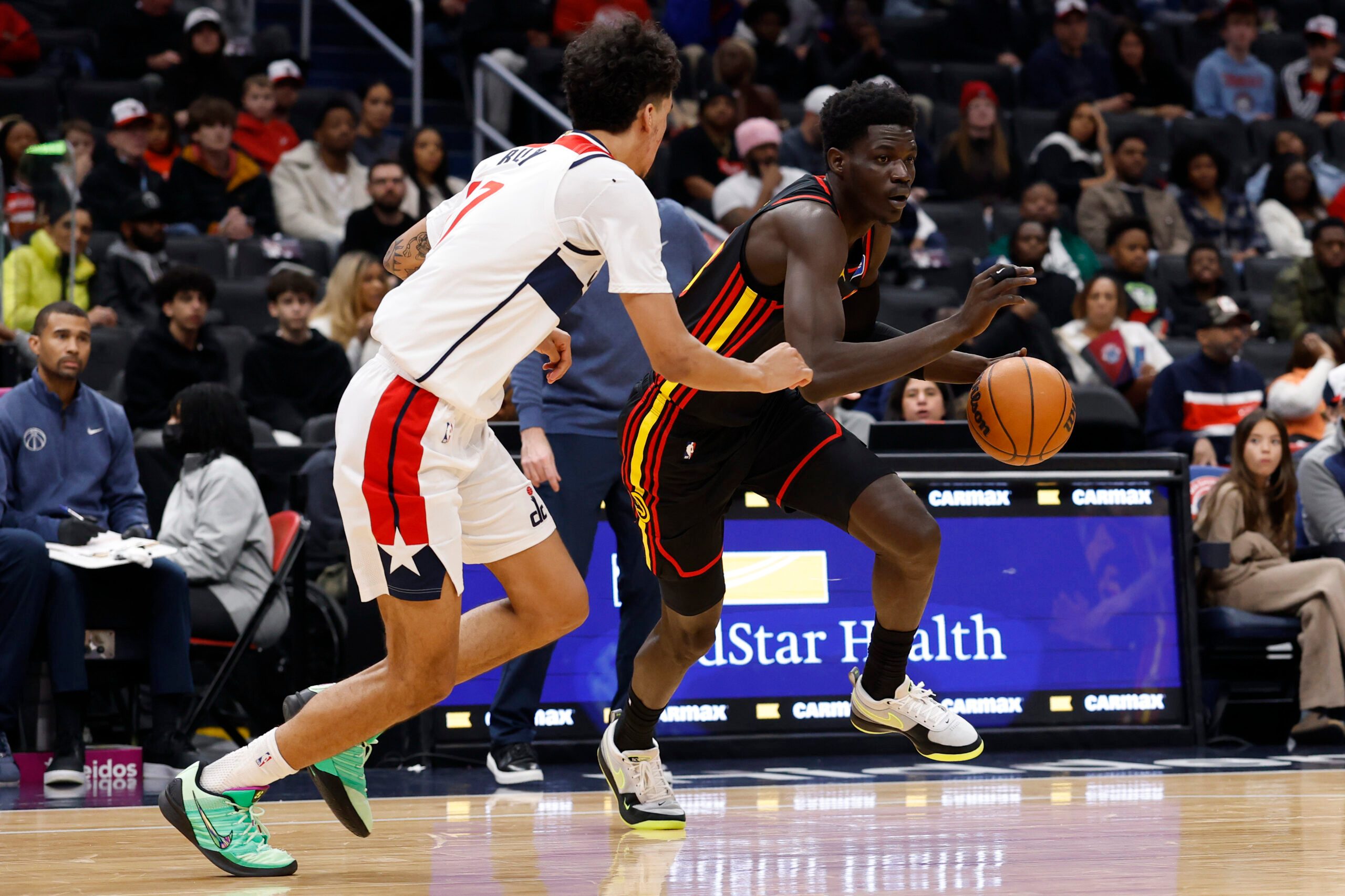 Dec 6, 2025; Washington, District of Columbia, USA; Atlanta Hawks forward Onyeka Okongwu (17) drives to the basket as Washington Wizards guard Will Riley (27) defends in the second half at Capital One Arena. Mandatory Credit: Geoff Burke-Imagn Images