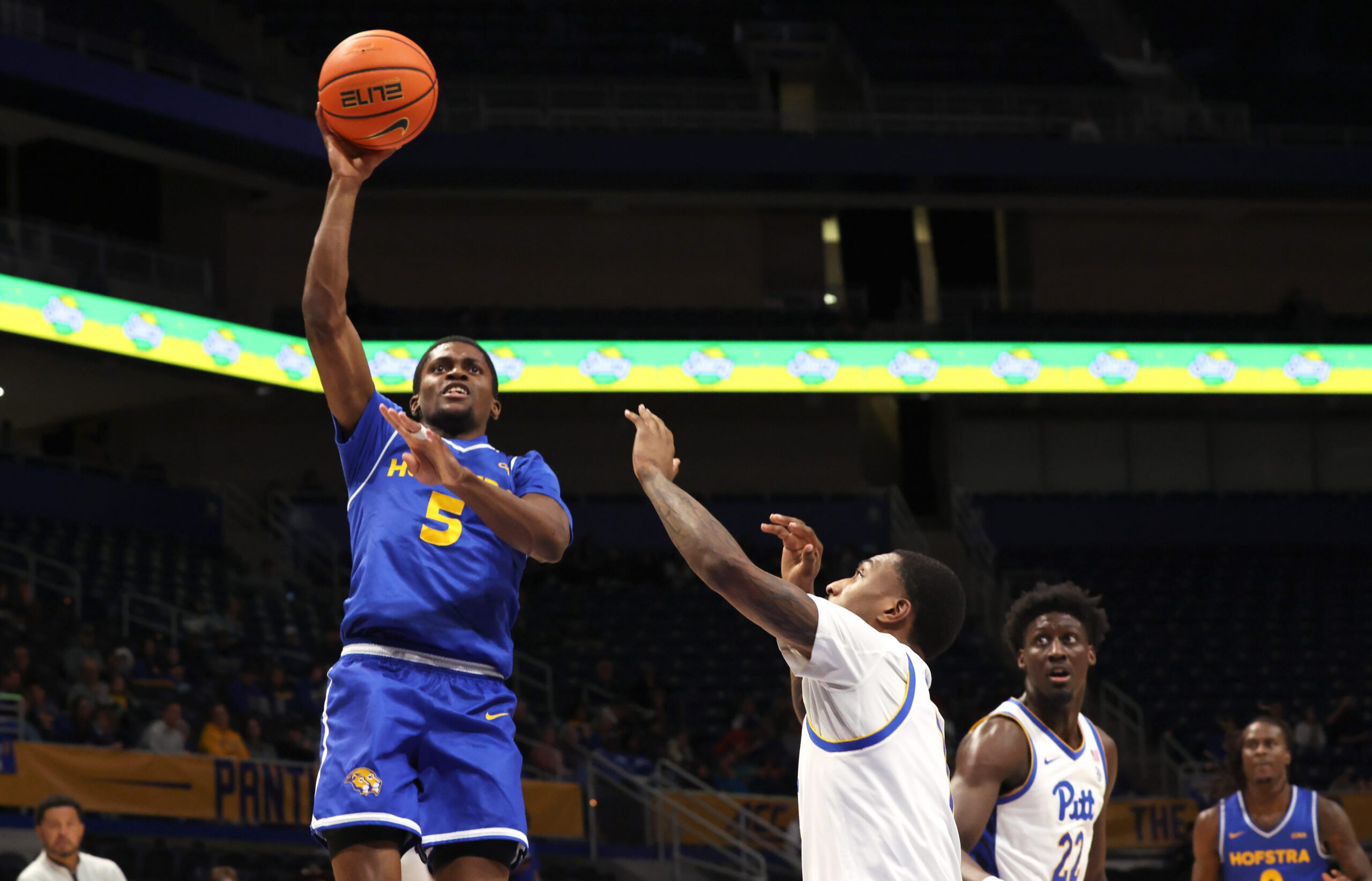 Dec 7, 2025; Pittsburgh, Pennsylvania, USA;  Hofstra Pride guard Cruz Davis (5) shoots over Pittsburgh Panthers guard Damarco Minor (right) during the first half against at the Petersen Events Center. Mandatory Credit: Charles LeClaire-Imagn Images