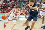 Indiana's Conor Enright (5) drives on Penn State's Eli Rice (11) during the Indiana versus Penn State men's basketball game at Simon Skjodt Assembly Hall on Tuesday, Dec. 9, 2025.