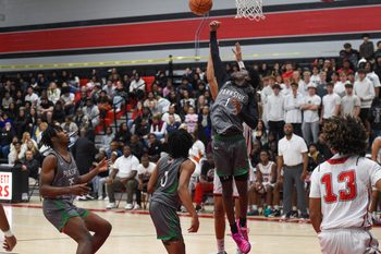 Parkside's Javon Comegys (1) reaches for the rebound against Bennett Thursday, Dec. 11, 2025, in Salisbury, Maryland. Parkside defeated Bennett 61-54.