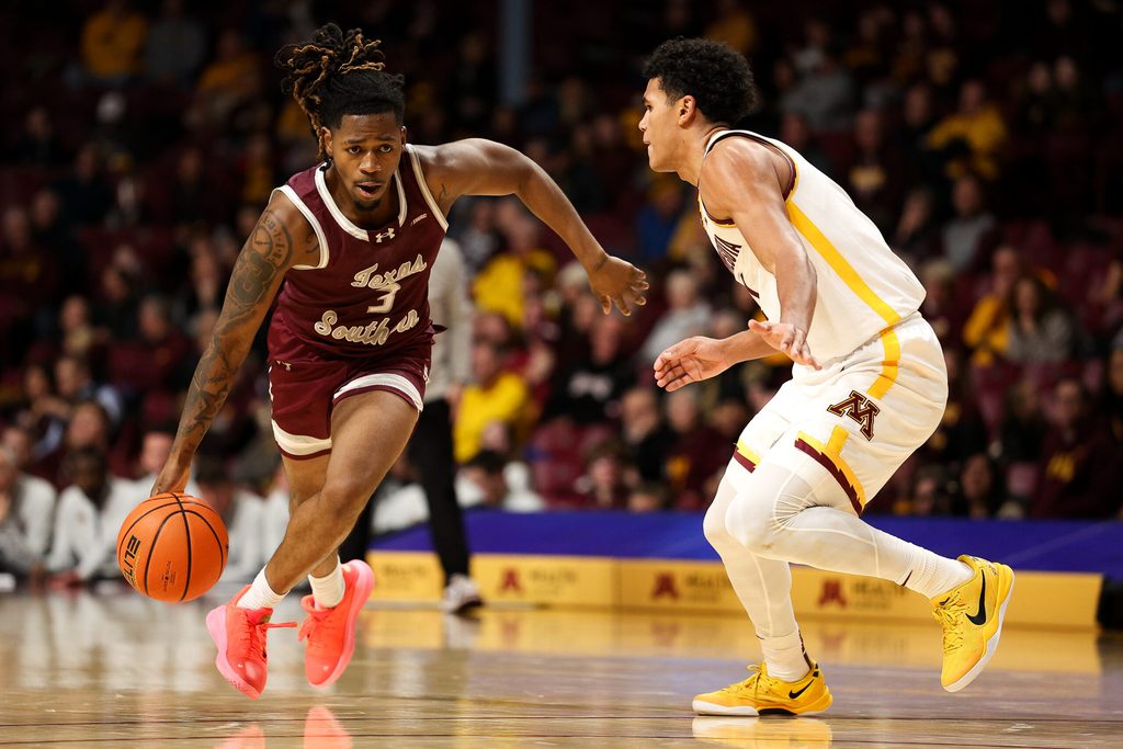 Dec 14, 2025; Minneapolis, Minnesota, USA; Texas Southern Tigers guard Bryce Roberts (3) works around Minnesota Golden Gophers guard Isaac Asuma (1) during the second half at Williams Arena. Mandatory Credit: Matt Krohn-Imagn Images
