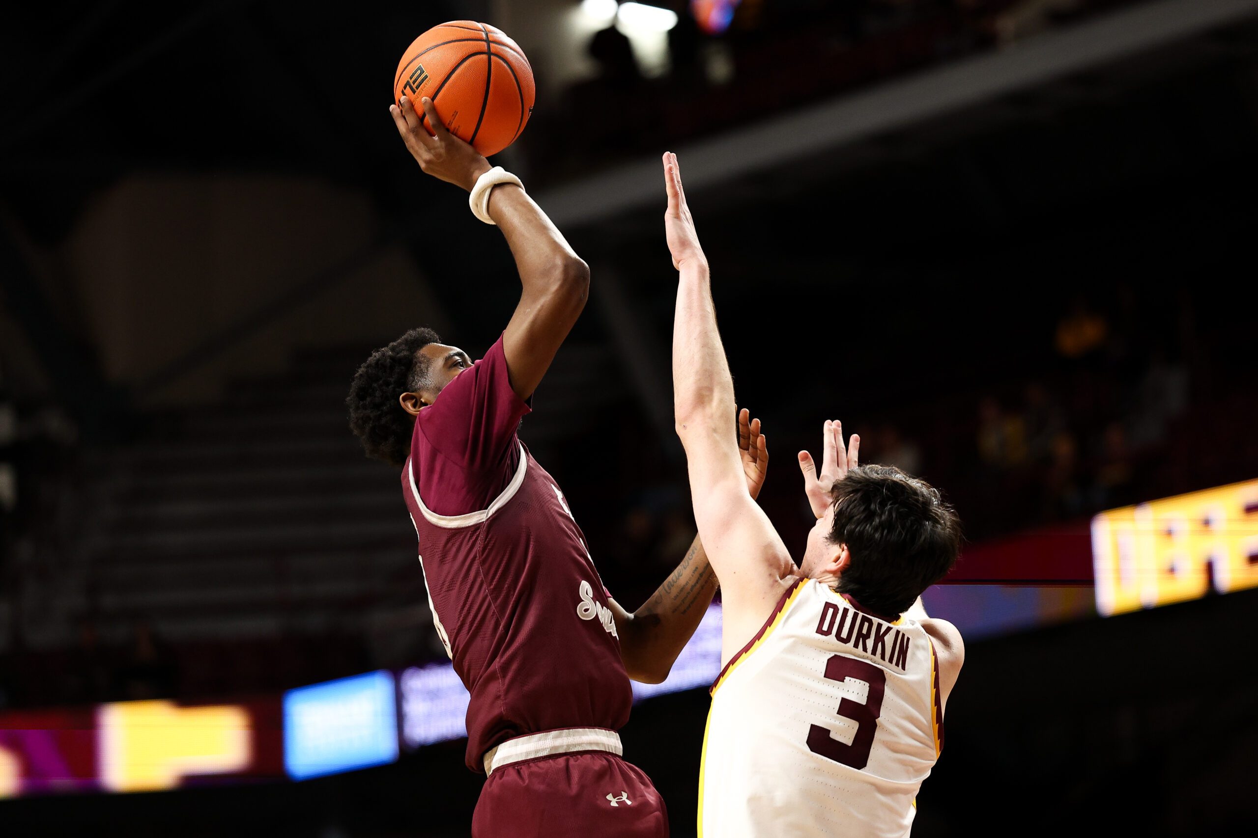 Dec 14, 2025; Minneapolis, Minnesota, USA; Texas Southern Tigers guard Alex Anderson (0) shoots as Minnesota Golden Gophers forward Bobby Durkin (3) defends during the second half at Williams Arena. Mandatory Credit: Matt Krohn-Imagn Images