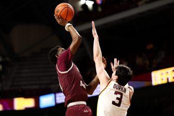Dec 14, 2025; Minneapolis, Minnesota, USA; Texas Southern Tigers guard Alex Anderson (0) shoots as Minnesota Golden Gophers forward Bobby Durkin (3) defends during the second half at Williams Arena. Mandatory Credit: Matt Krohn-Imagn Images