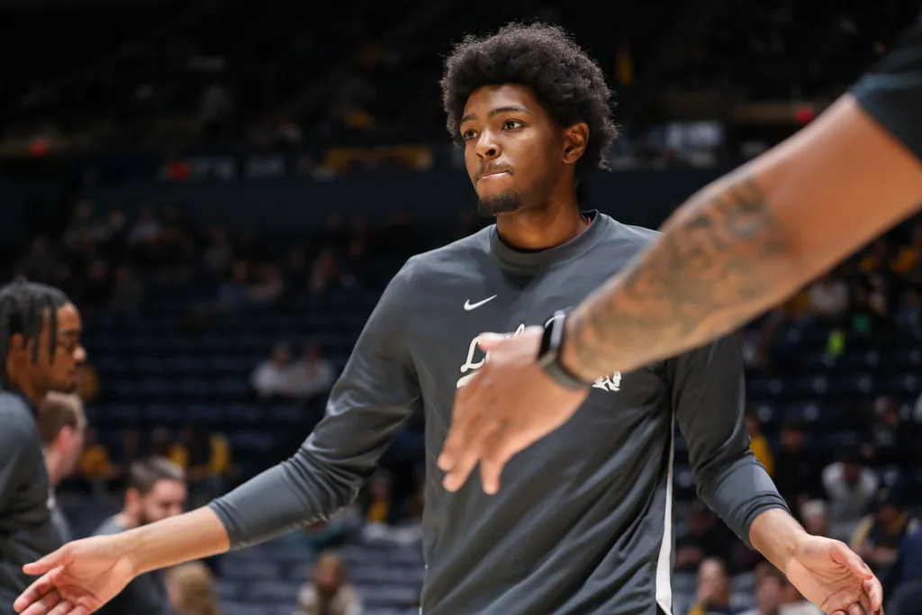 Dec 9, 2025; Morgantown, West Virginia, USA; Little Rock Trojans guard Johnathan Lawson (11) is introduced in the starting lineup before their game against the West Virginia Mountaineers at Hope Coliseum. Mandatory Credit: Ben Queen-Imagn Images
