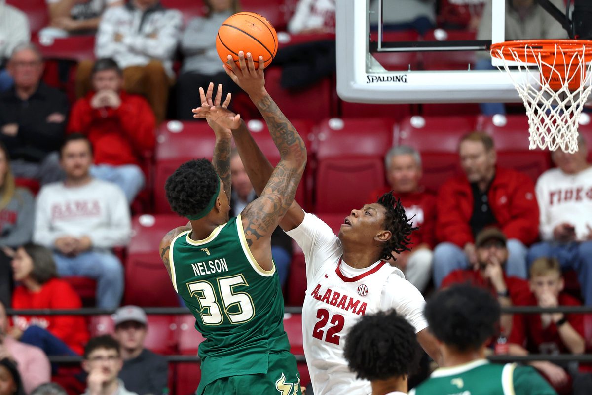 Dec 17, 2025; Tuscaloosa, Alabama, USA; Alabama Crimson Tide forward Aiden Sherrell (22) blocks South Florida Bulls forward Izaiyah Nelson (35) during the first half at Coleman Coliseum. Mandatory Credit: David Leong-Imagn Images