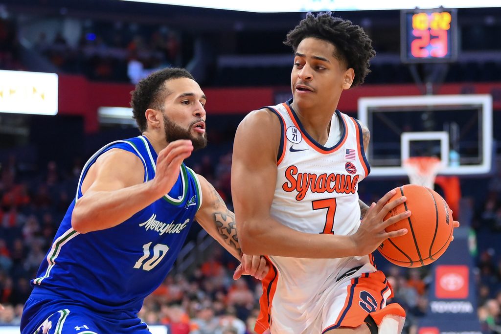 Dec 17, 2025; Syracuse, New York, USA; Syracuse Orange guard Kiyan Anthony (7) drives against Mercyhurst Lakers guard Christian Gamble (10) during the second half at the JMA Wireless Dome. Mandatory Credit: Rich Barnes-Imagn Images