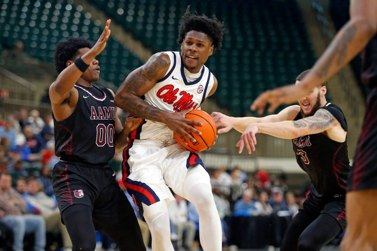 Dec 17, 2025; Tupelo, Mississippi, USA; Mississippi Rebels guard AJ Storr (2) drives to the basket as Alabama A&M Bulldogs guard Kintavious Dozier (00) defends during the second half at Cadence Bank Arena. Mandatory Credit: Petre Thomas-Imagn Images