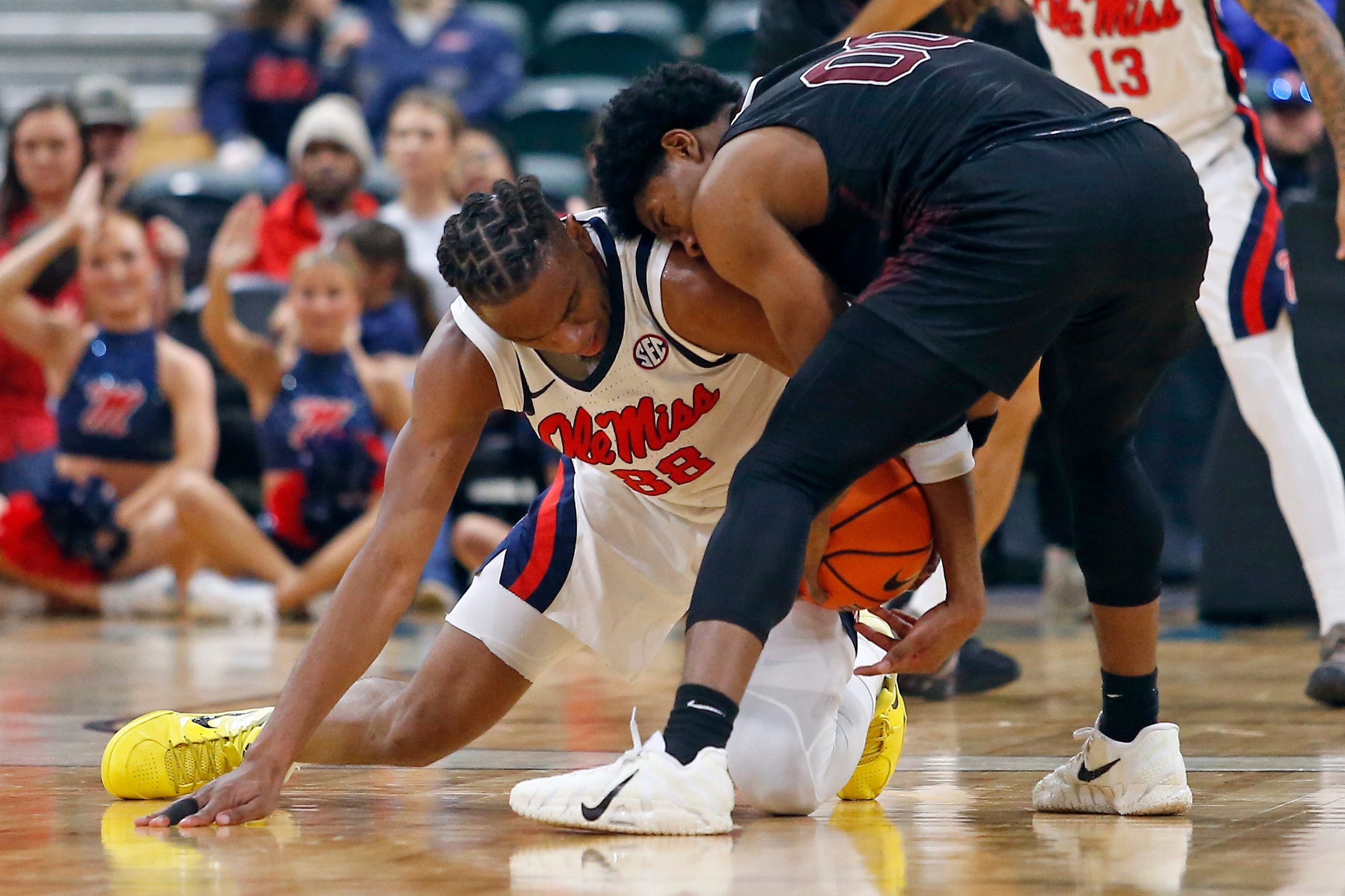 Dec 17, 2025; Tupelo, Mississippi, USA; Mississippi Rebels forward Augusto Cassia (88) and Alabama A&M Bulldogs guard Kintavious Dozier (00) battle for the ball during the second half at Cadence Bank Arena. Mandatory Credit: Petre Thomas-Imagn Images