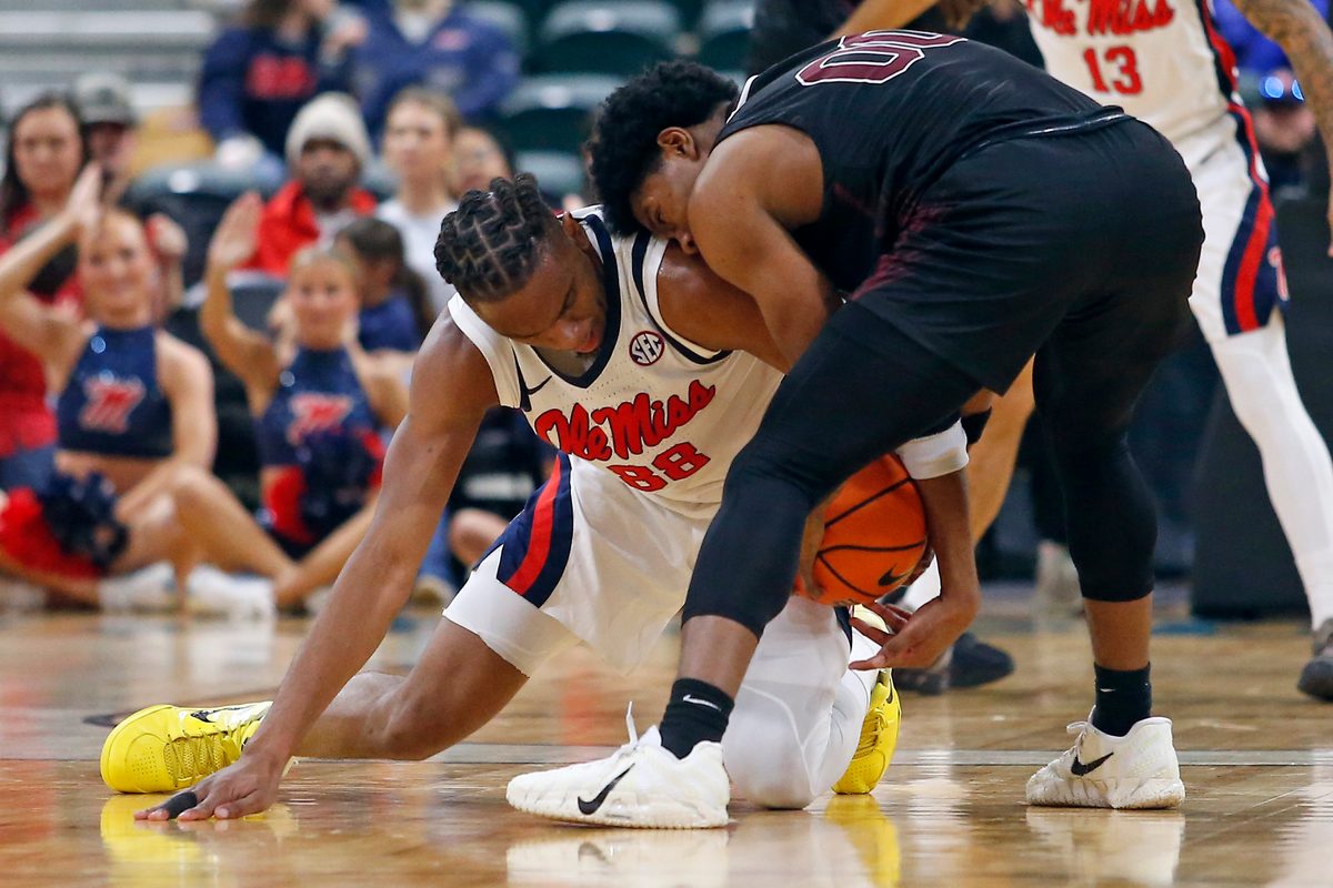 Dec 17, 2025; Tupelo, Mississippi, USA; Mississippi Rebels forward Augusto Cassia (88) and Alabama A&M Bulldogs guard Kintavious Dozier (00) battle for the ball during the second half at Cadence Bank Arena. Mandatory Credit: Petre Thomas-Imagn Images