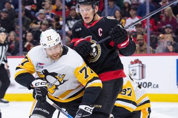 Dec 18, 2025; Ottawa, Ontario, CAN; Pittsburgh Penguins defenseman Brett Kulak (77) battles with Ottawa Senators left wing Brady Tkachuk (7) in the first period at the Canadian Tire Centre. Mandatory Credit: Marc DesRosiers-IMAGN Images