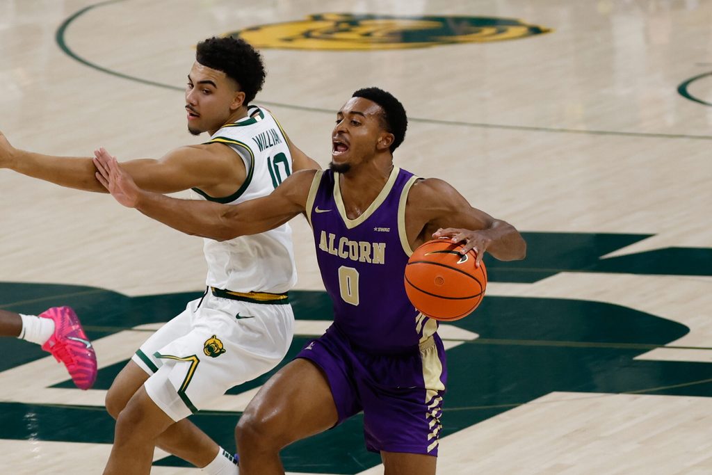 Dec 19, 2025; Waco, Texas, USA; Alcorn State Braves guard Shane Lancaster (0) dribbles past Baylor Bears guard Isaac Williams (10) during the first half at Paul and Alejandra Foster Pavilion. Mandatory Credit: Chris Jones-Imagn Images