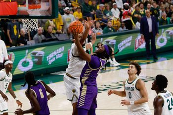 Dec 19, 2025; Waco, Texas, USA;  Alcorn State Braves guard Omari Hamilton (12) scores a layup against Baylor Bears center Caden Powell (44) during the first half at Paul and Alejandra Foster Pavilion. Mandatory Credit: Chris Jones-Imagn Images