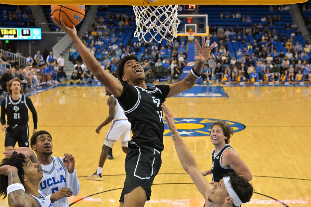 Dec 19, 2025; Los Angeles, California, USA; Cal Poly Mustangs guard Cayden Ward (14) goes up for a basket during the second half against the UCLA Bruins at Pauley Pavilion presented by Wescom Financial. Mandatory Credit: Jayne Kamin-Oncea-Imagn Images