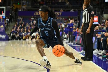 Dec 22, 2025; Seattle, Washington, USA; San Diego Toreros guard Ty-Laur Johnson (5) dribbles the ball during the second half against the Washington Huskies at Alaska Airlines Arena at Hec Edmundson Pavilion. Mandatory Credit: Steven Bisig-Imagn Images