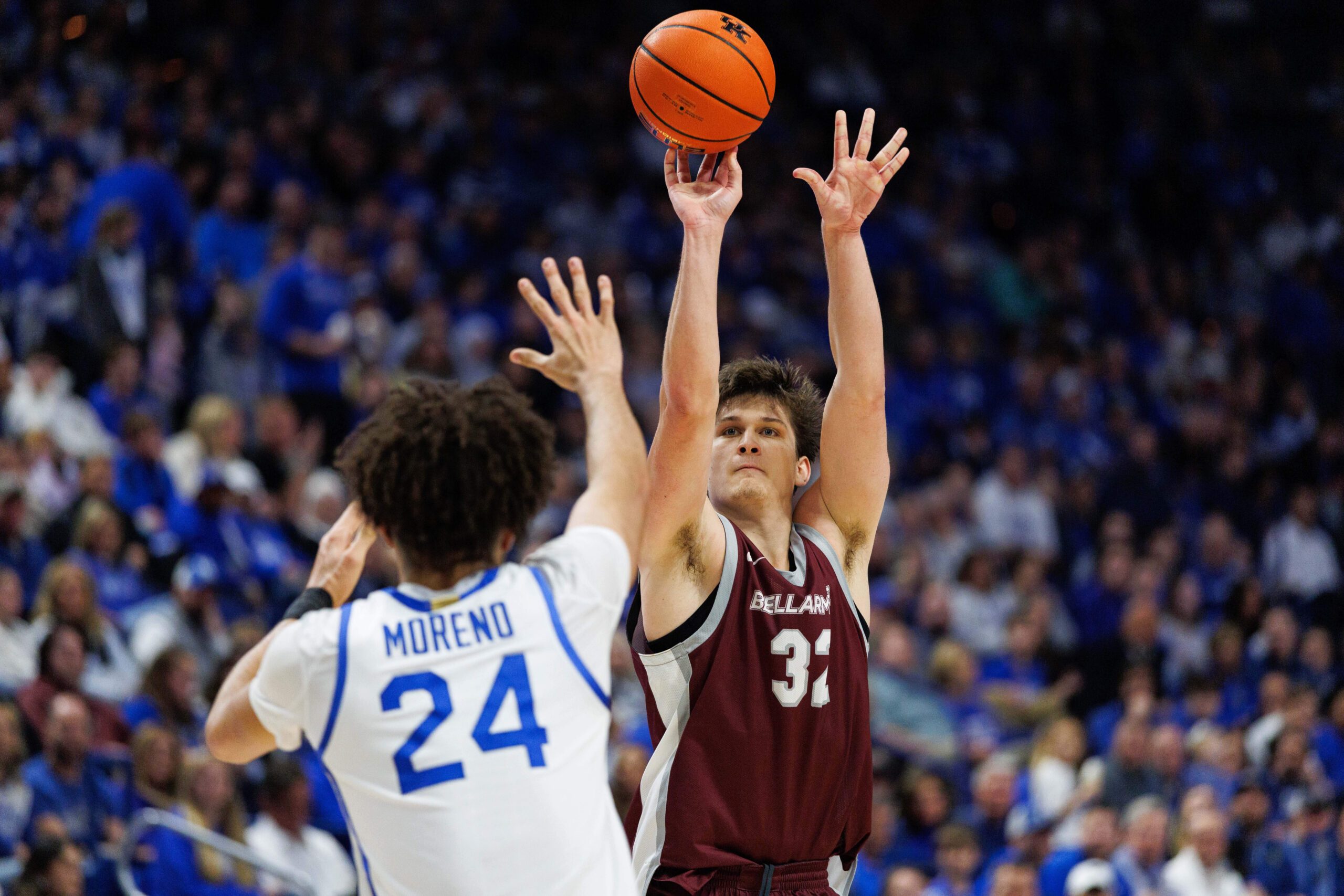 Dec 23, 2025; Lexington, Kentucky, USA; Bellarmine Knights forward Jack Karasinski (32) shoots the ball against Kentucky Wildcats center Malachi Moreno (24) during the first half at Rupp Arena at Central Bank Center. Mandatory Credit: Jordan Prather-Imagn Images