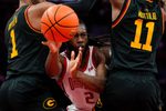 Ohio State Buckeyes guard Bruce Thornton (2) passes the ball against Grambling State Tigers forward Roderick Coffee III (1) and guard Jamil Muttilib (11) in the first half of the NCAA men’s basketball game Value City Arena on Tuesday, Dec. 23, 2025 in Columbus, Ohio.