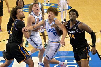 Dec 23, 2025; Los Angeles, California, USA; UCLA Bruins forward Tyler Bilodeau (34), guard Jamar Brown (4) and UC Riverside Highlanders forward Osiris Grady (9) guard Andrew Henderson (12) battle for position after a free throw in the first half at Pauley Pavilion presented by Wescom Financial. Mandatory Credit: Jayne Kamin-Oncea-Imagn Images