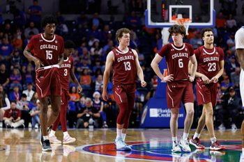 Dec 21, 2025; Gainesville, Florida, USA; Colgate Raiders forward Ayomi Odetoyinbo (15), Colgate Raiders guard Kyle Carlesimo (13), Colgate Raiders guard Ben Tweedy (6) and Colgate Raiders forward Cooper Wright (23) walk on the court against the Florida Gators during the second half at Exactech Arena at the Stephen C. O'Connell Center. Mandatory Credit: Matt Pendleton-Imagn Images