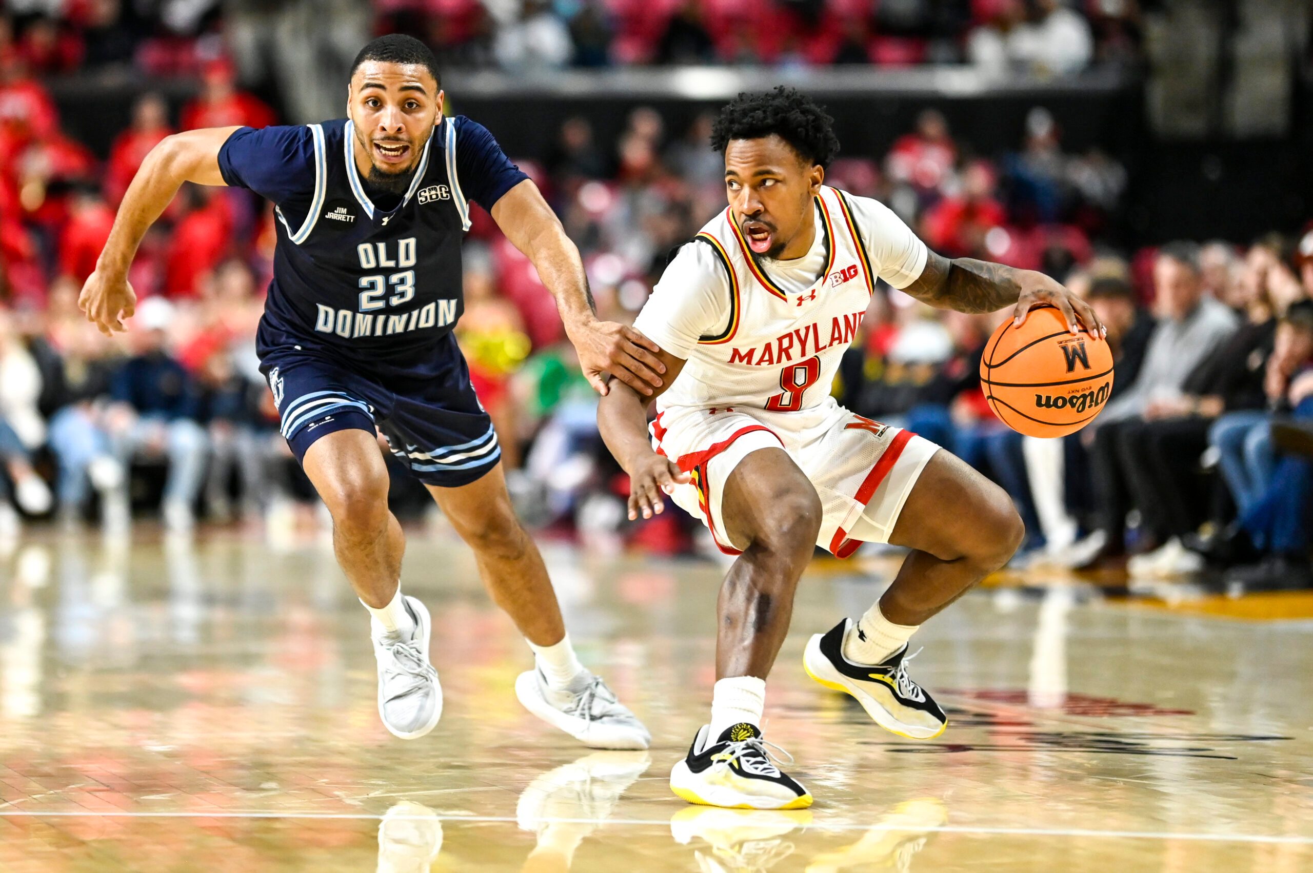 Dec 28, 2025; College Park, Maryland, USA; Maryland Terrapins guard David Coit (8) dribbles as Old Dominion Monarchs guard Jordan Battle (23) defends during the second half  at Xfinity Center. Mandatory Credit: Tommy Gilligan-Imagn Images