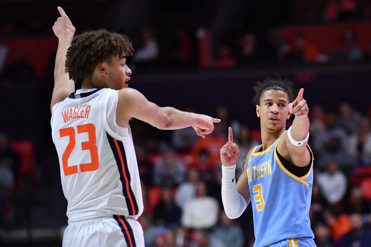 Dec 29, 2025; Champaign, Illinois, USA;  Illinois Fighting Illini guard Keaton Wagler (23) and Southern University Jaguars guard Cam Amboree (3) look for a possession call   during the second half at State Farm Center. Mandatory Credit: Ron Johnson-Imagn Images