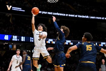 Dec 29, 2025; Nashville, Tennessee, USA;  Vanderbilt Commodores guard Tyler Tanner (3) shoots over New Haven Chargers guard Jabri Fitzpatrick (1) during the second half at Memorial Gymnasium. Mandatory Credit: Steve Roberts-Imagn Images