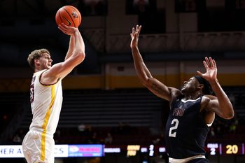 Dec 29, 2025; Minneapolis, Minnesota, USA; Minnesota Golden Gophers forward Cade Tyson (10) shoots the ball over Fairleigh Dickinson Knights forward Taeshaud Jackson (2) during the first half at Williams Arena. Mandatory Credit: Matt Krohn-Imagn Images