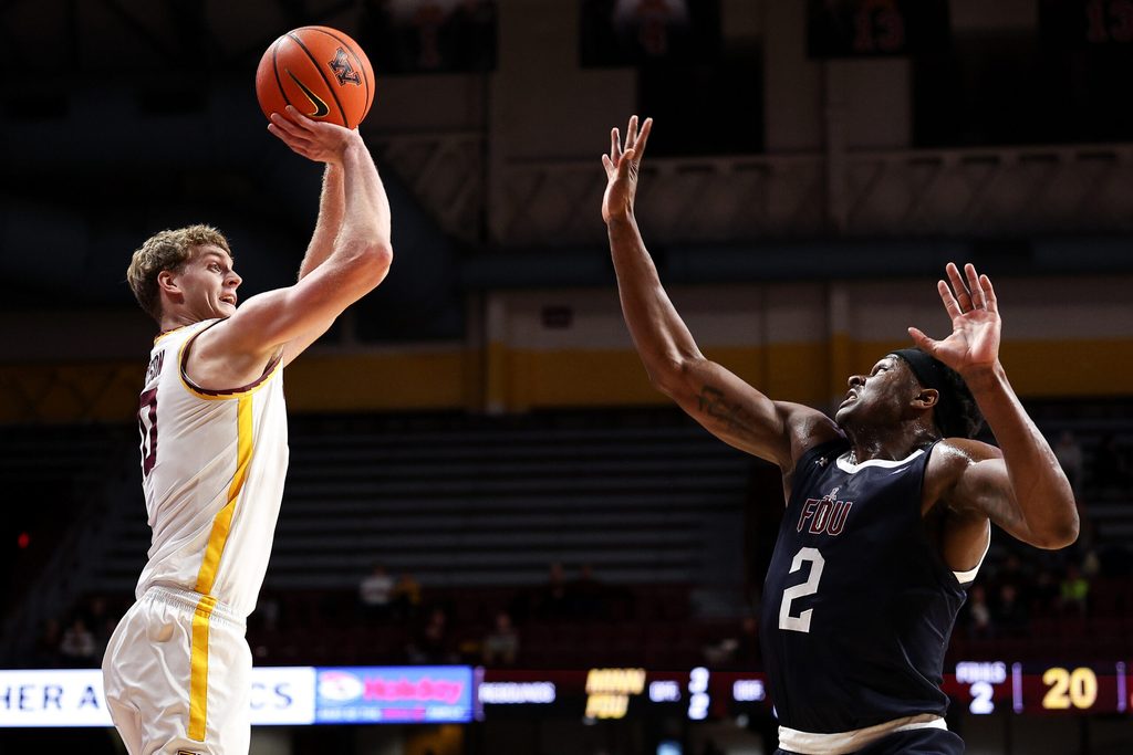 Dec 29, 2025; Minneapolis, Minnesota, USA; Minnesota Golden Gophers forward Cade Tyson (10) shoots the ball over Fairleigh Dickinson Knights forward Taeshaud Jackson (2) during the first half at Williams Arena. Mandatory Credit: Matt Krohn-Imagn Images