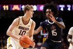 Dec 29, 2025; Minneapolis, Minnesota, USA; Minnesota Golden Gophers forward Cade Tyson (10) works around Fairleigh Dickinson Knights guard Josiah Francis (15) during the first half at Williams Arena. Mandatory Credit: Matt Krohn-Imagn Images