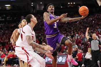 Dec 29, 2025; Fayetteville, Arkansas, USA; James Madison Dukes forward Eddie Ricks III (3) attempts a shot in the second half against the Arkansas Razorbacks at Bud Walton Arena. Arkansas won 103-74. Mandatory Credit: Nelson Chenault-Imagn Images