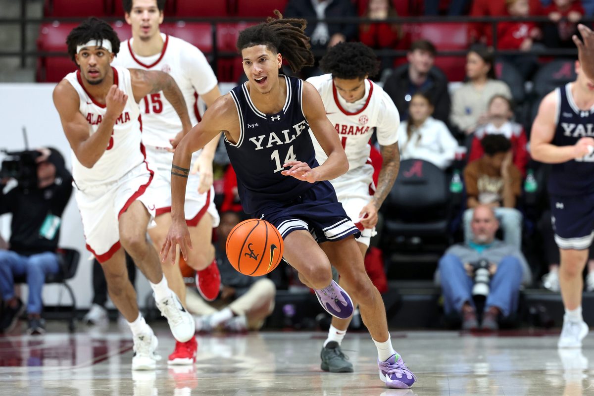 Dec 29, 2025; Tuscaloosa, Alabama, USA; Yale Bulldogs guard Casey Simmons (14) goes on a fast break during the second half against the Alabama Crimson Tide at Coleman Coliseum. Mandatory Credit: David Leong-Imagn Images
