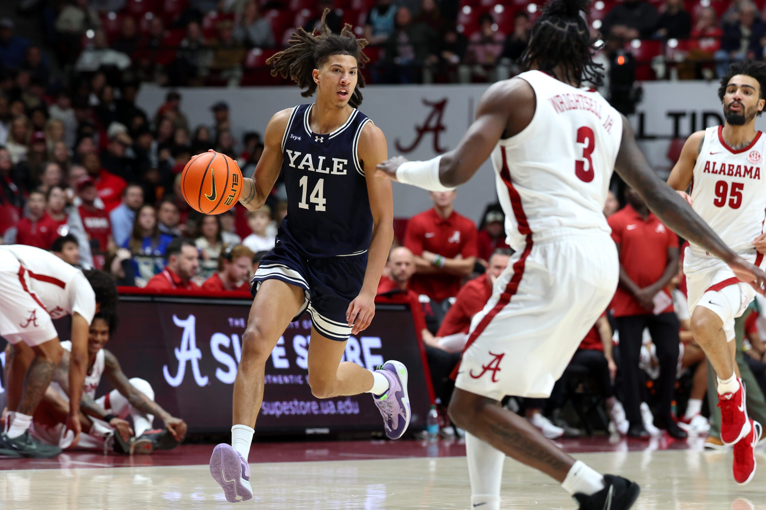 Dec 29, 2025; Tuscaloosa, Alabama, USA; Yale Bulldogs guard Casey Simmons (14) goes on a fast break during the second half against the Alabama Crimson Tide at Coleman Coliseum. Mandatory Credit: David Leong-Imagn Images