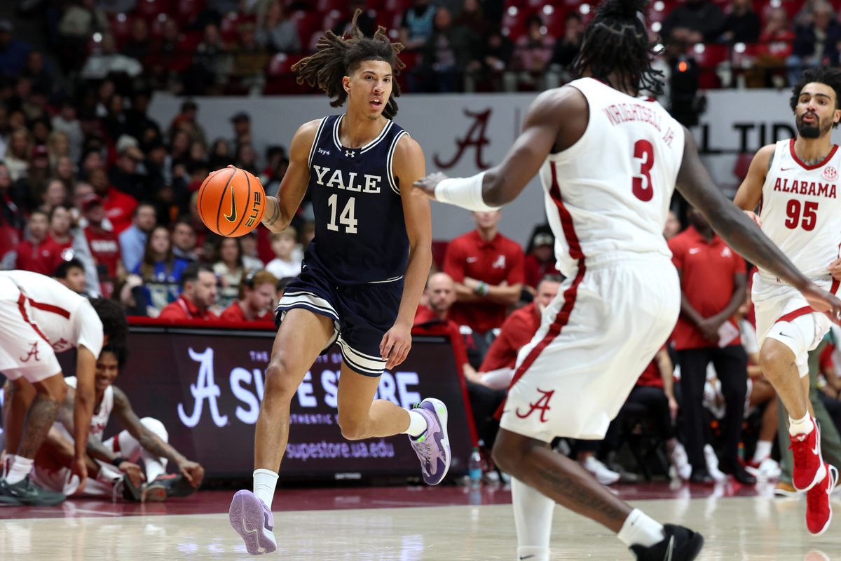 Dec 29, 2025; Tuscaloosa, Alabama, USA; Yale Bulldogs guard Casey Simmons (14) goes on a fast break during the second half against the Alabama Crimson Tide at Coleman Coliseum. Mandatory Credit: David Leong-Imagn Images