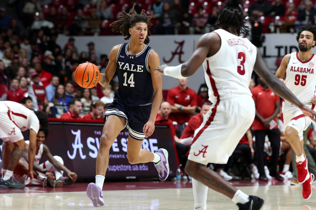 Dec 29, 2025; Tuscaloosa, Alabama, USA; Yale Bulldogs guard Casey Simmons (14) goes on a fast break during the second half against the Alabama Crimson Tide at Coleman Coliseum. Mandatory Credit: David Leong-Imagn Images