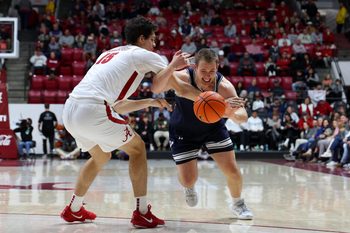 Dec 29, 2025; Tuscaloosa, Alabama, USA; Yale Bulldogs forward Nick Townsend (42) dribbles against Alabama Crimson Tide center Noah Williamson (15) during the second half at Coleman Coliseum. Mandatory Credit: David Leong-Imagn Images