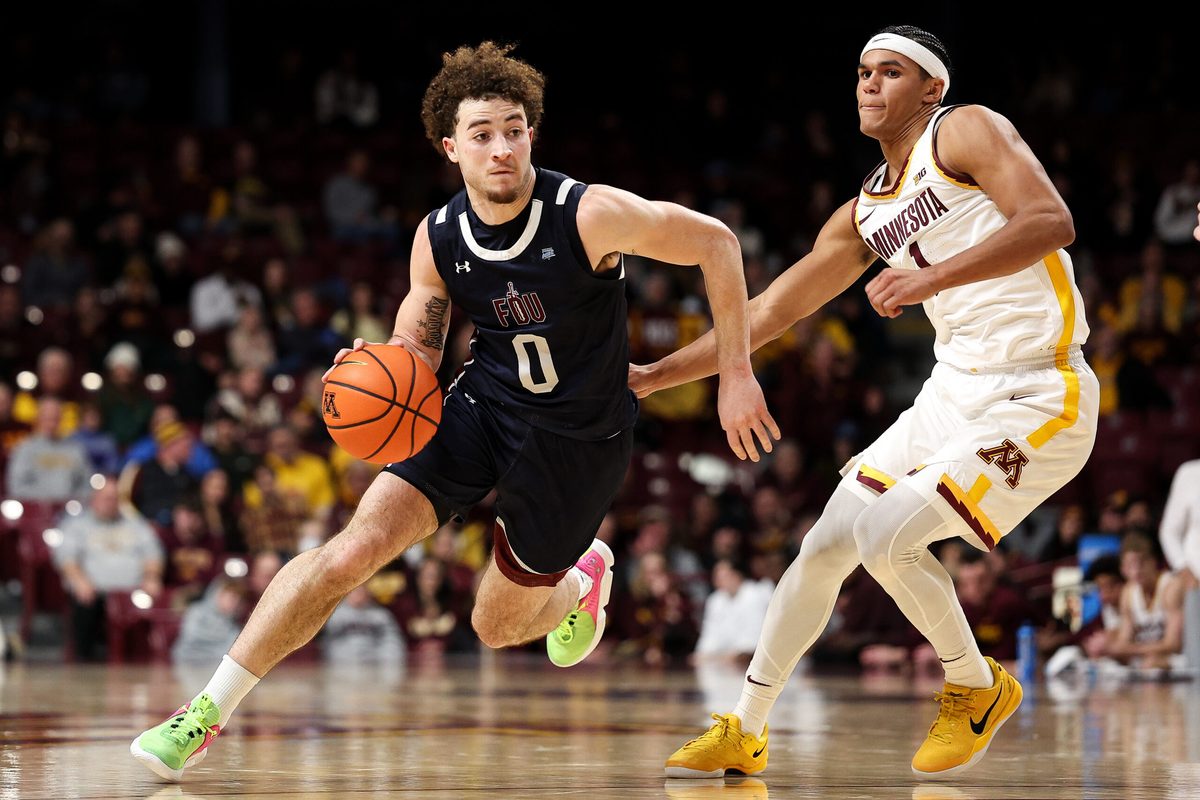 Dec 29, 2025; Minneapolis, Minnesota, USA; Fairleigh Dickinson Knights guard Joey Niesman (0) works around Minnesota Golden Gophers guard Isaac Asuma (1) during the second half at Williams Arena. Mandatory Credit: Matt Krohn-Imagn Images