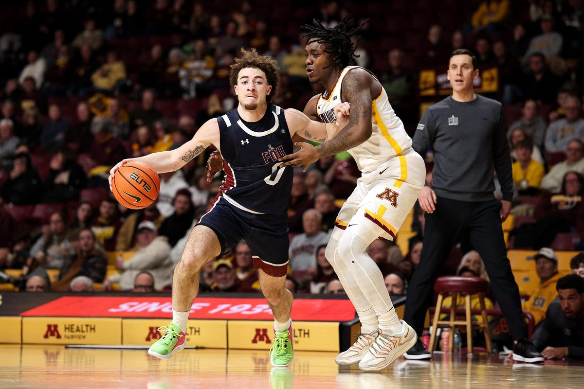 Dec 29, 2025; Minneapolis, Minnesota, USA; Fairleigh Dickinson Knights guard Joey Niesman (0) works around Minnesota Golden Gophers guard Langston Reynolds (6) during the second half at Williams Arena. Mandatory Credit: Matt Krohn-Imagn Images