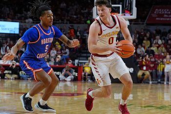 Iowa State Cyclones guard Nate Heise (0) drives with the ball around Houston Christian Huskies guard D'Aundre Samuels (5) during the first half in the NCAA men’s basketball on Dec. 29. 2025, at Hilton Coliseum in Ames, Iowa.