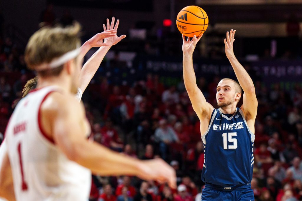 Dec 30, 2025; Lincoln, Nebraska, USA; New Hampshire Wildcats forward Davide Poser (15) shoots against the Nebraska Cornhuskers during the second half at Pinnacle Bank Arena. Mandatory Credit: Dylan Widger-Imagn Images