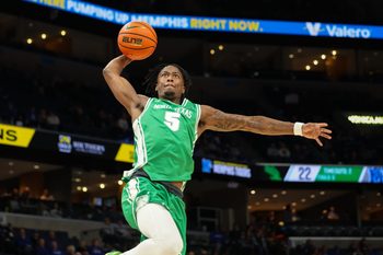 Dec 31, 2025; Memphis, Tennessee, USA; North Texas Mean Green guard David Terrell Jr. (5) dunks the ball against the Memphis Tigers during the second half at FedExForum. Mandatory Credit: Wesley Hale-Imagn Images