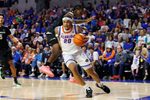Dec 29, 2025; Gainesville, Florida, USA; Florida Gators guard Isaiah Brown (20) drives to the basket past Dartmouth Big Green guard Kareem Thomas (2) during the second half at Exactech Arena at the Stephen C. O'Connell Center. Mandatory Credit: Matt Pendleton-Imagn Images