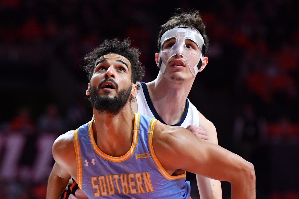 Dec 29, 2025; Champaign, Illinois, USA; Illinois Fighting Illini forward Zvonimir Ivisic (back) and Southern University Jaguars forward Malek Abdelgowad (8) wait for a rebound during the first half at State Farm Center. Mandatory Credit: Ron Johnson-Imagn Images