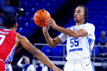 Middle Tennessee guard Sean Smith (55) passes the ball as La Tech guard DJ Dudley (0) guards him during the men's NCAA game on Friday, Jan. 2, 2026, at MTSU.