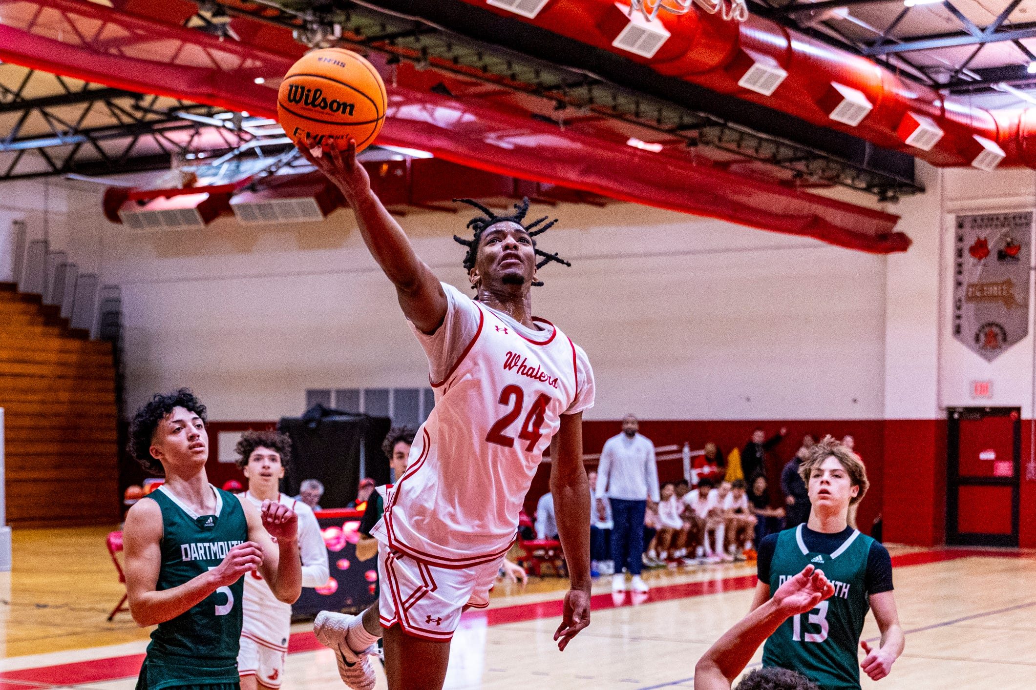 New Bedford's Chris Patterson powers his way to the basket as New Bedford more then double up Dartmouth 89-44 at home on Monday, January 5th.