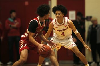 Lakota West junior Parker Robinson (4) keeps a close eye on Fairfield senior Cam Arington (2) as Lakota West defeated Fairfield, 58-41 in OHSAA boys basketball Jan. 9, 2026 at Lakota West.