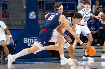Drake's Andrew Alia tips the ball from Belmont's Tyler Lundblade during a game at Knapp Center on Saturday, Jan. 10, 2026 in Des Moines.