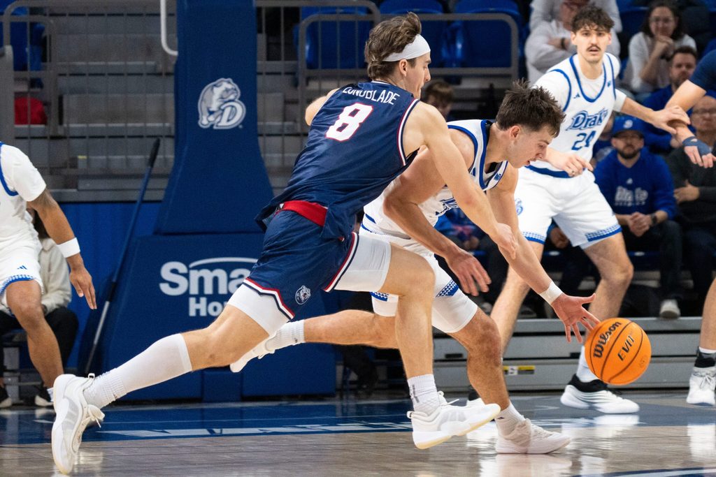 Drake's Andrew Alia tips the ball from Belmont's Tyler Lundblade during a game at Knapp Center on Saturday, Jan. 10, 2026 in Des Moines.