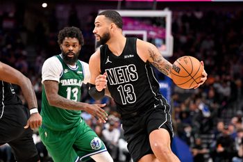 Jan 12, 2026; Dallas, Texas, USA; Brooklyn Nets guard Tyrese Martin (13) brings the ball up court past Dallas Mavericks forward Naji Marshall (13) during the second half at the American Airlines Center. Mandatory Credit: Jerome Miron-Imagn Images