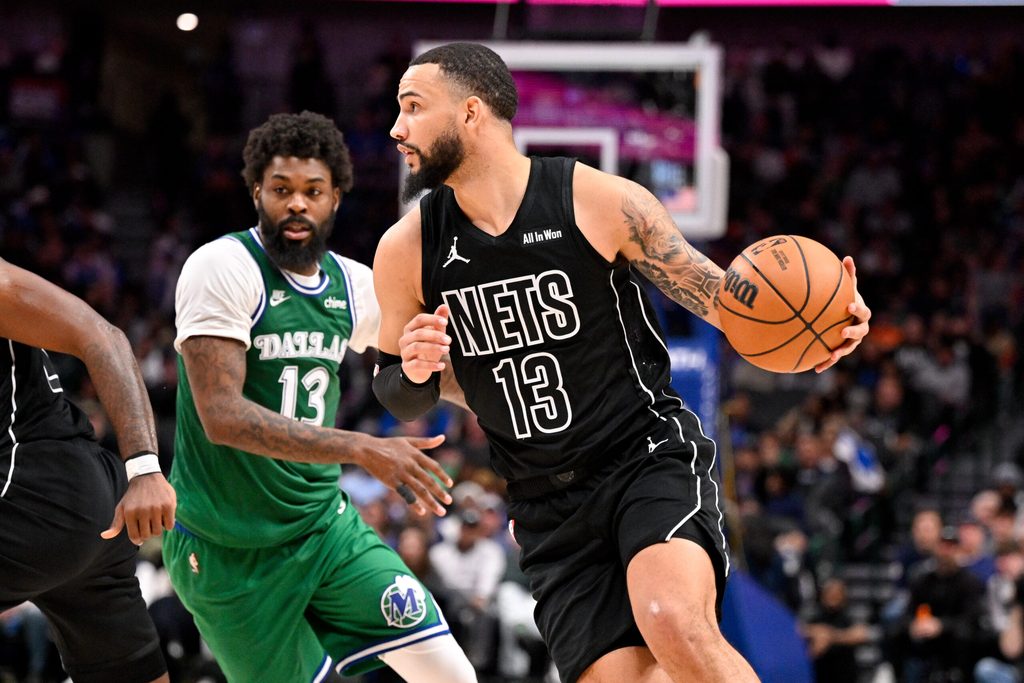 Jan 12, 2026; Dallas, Texas, USA; Brooklyn Nets guard Tyrese Martin (13) brings the ball up court past Dallas Mavericks forward Naji Marshall (13) during the second half at the American Airlines Center. Mandatory Credit: Jerome Miron-Imagn Images