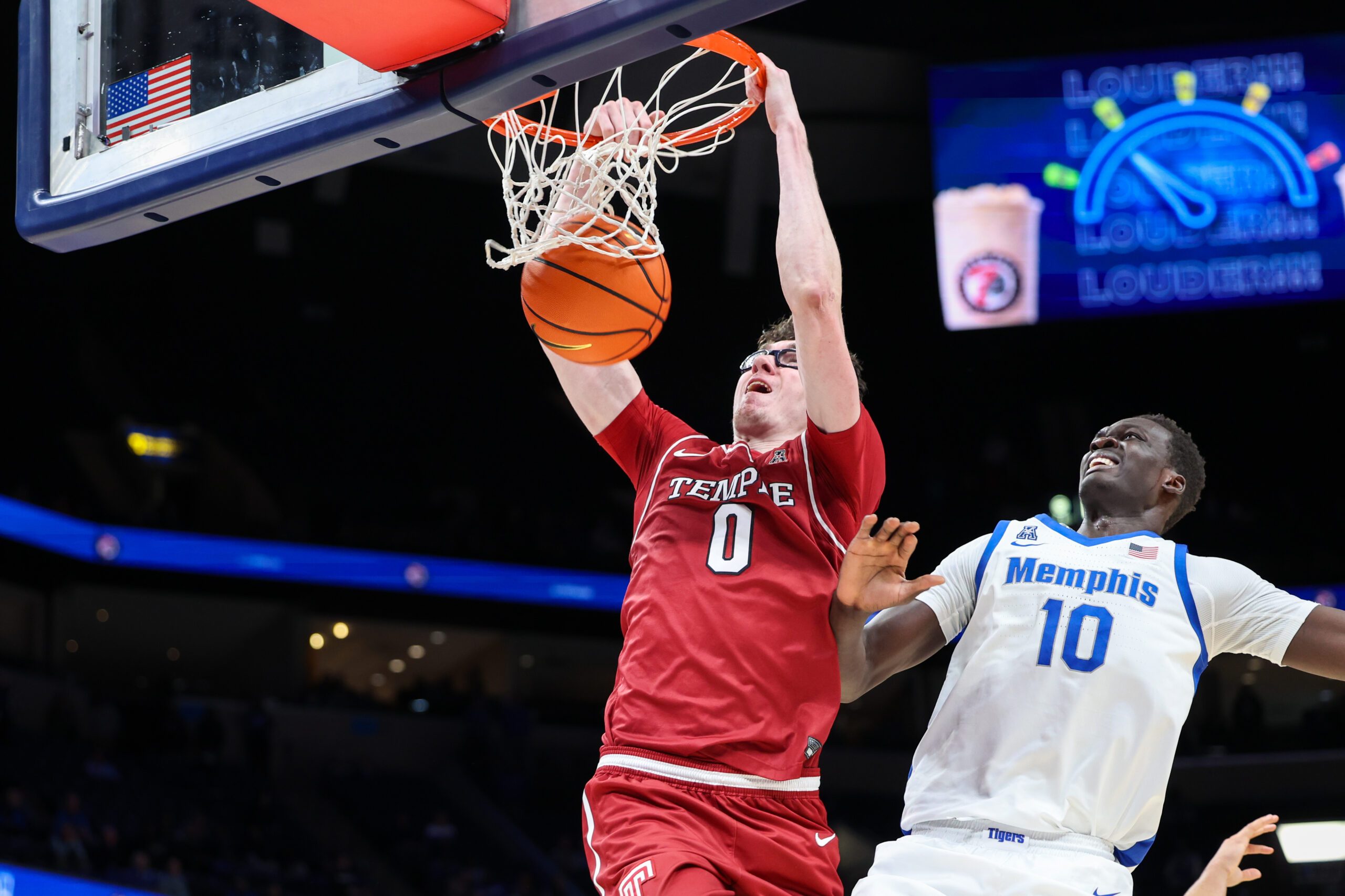 Jan 14, 2026; Memphis, Tennessee, USA; Temple Owls guard Gavin Griffiths (0) dunks the ball against the Memphis Tigers during the second half at FedExForum. Mandatory Credit: Wesley Hale-Imagn Images
