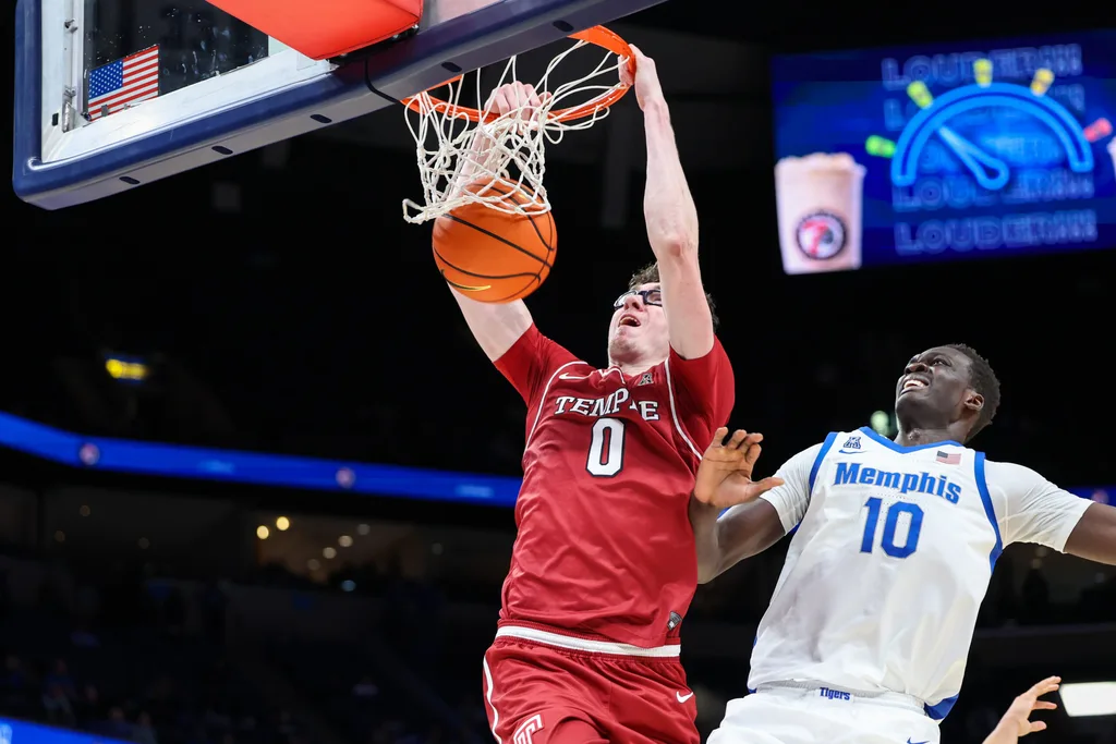 Jan 14, 2026; Memphis, Tennessee, USA; Temple Owls guard Gavin Griffiths (0) dunks the ball against the Memphis Tigers during the second half at FedExForum. Mandatory Credit: Wesley Hale-Imagn Images